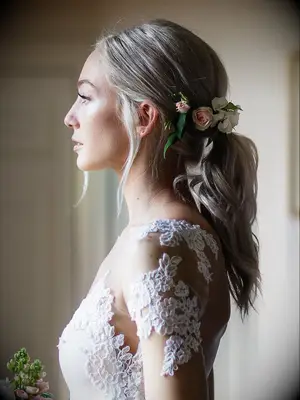 wedding hair flowers above low ponytail