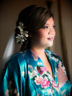 wedding hair flowers small orchids atop low side bun