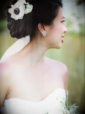 wedding hair flowers side bun with anemones