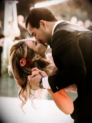 wedding hair flowers down pulled to one side with one flower