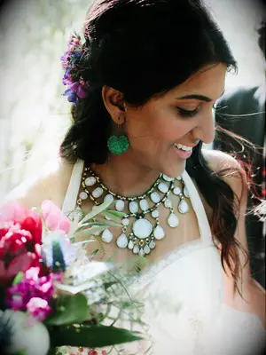 wedding hair flowers braided half up with purple florals