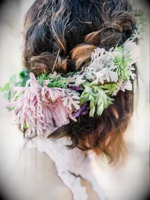 wedding hair flowers braided half up with oversize flowers