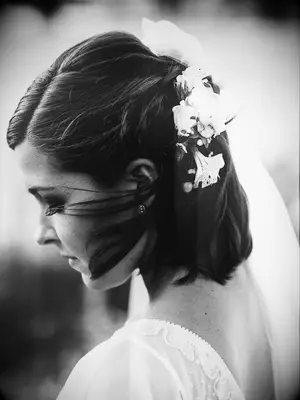 wedding hair flowers braided half up with flowers one one side