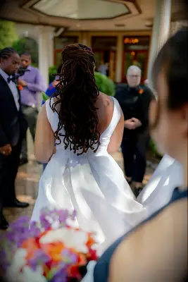 Half-up half-down curly locs Black wedding hairstyle