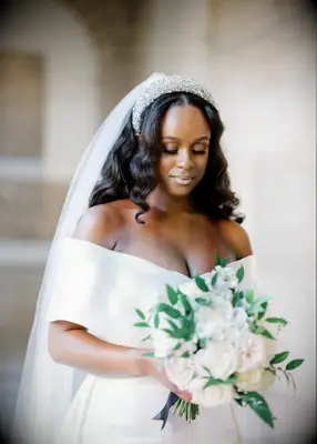 Long hair with loose curls and bejewelled headband Black wedding hairstyle