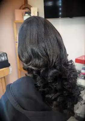 Long hair with big curls Black wedding hairstyle