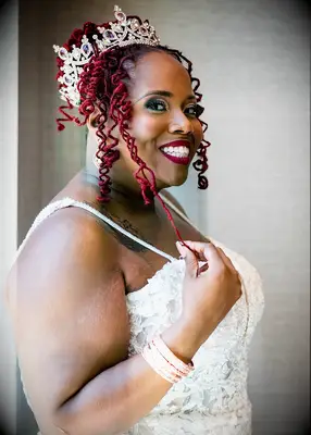 Curly locs in top bun Black wedding hairstyle