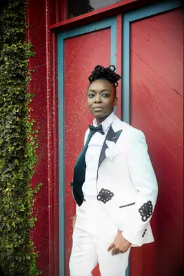 Locs in a large bun Black wedding hairstyle