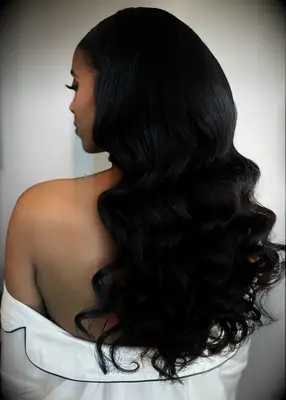 Long hair with loose curls Black wedding hairstyle