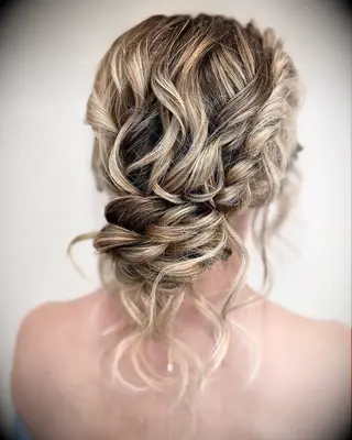 Messy bun with braid wedding hairstyle