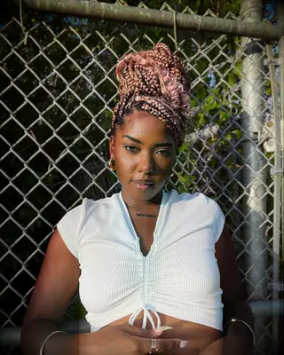 Pink braided bun wedding hairstyle