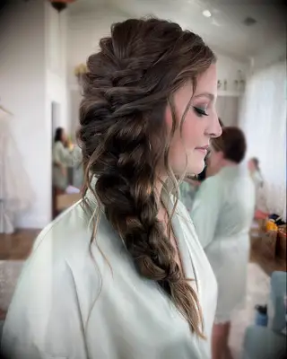 Side swept braided wedding hairstyle