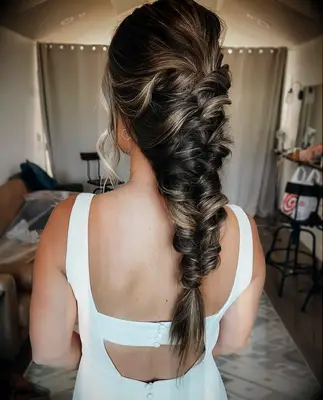 Down the back fishtail braid wedding hairstyle