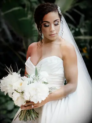 natural wedding hairstyle low bun with pieces out front