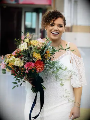 natural wedding hairstyles low bun with bangs