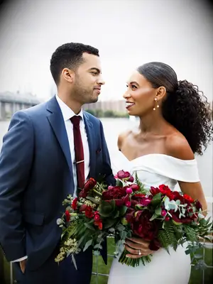 natural wedding hairstyle slicked back ponytail with center part