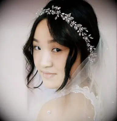 Short wedding updo with crystal headband and veil