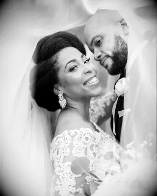 Voluminous natural curls wedding hairstyle for short hair with veil