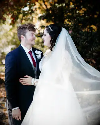 Wedding hairstyle for short hair with soft curls and veil