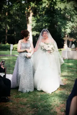 Formal updo with side swept bangs mother of the bride hairstyle