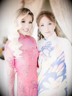 Half up mother of the bride hairstyle with curtain bangs