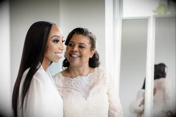 Shoulder length half up mother of the bride hairstyle