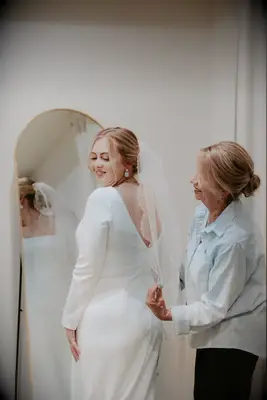 Small bun medium length mother of the bride hairstyle 