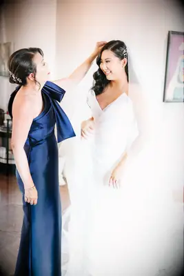 Sleek mother of the bride updo with pearl accessory 