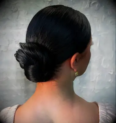 Sleek low bun medium length wedding hairstyle