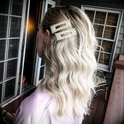 Pearl hairclips medium-length bridal hairstyle