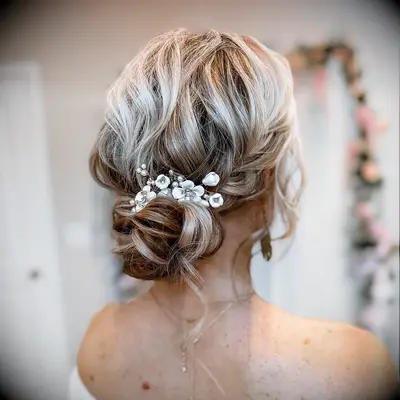 Floral hairpins medium length wedding hairstyle