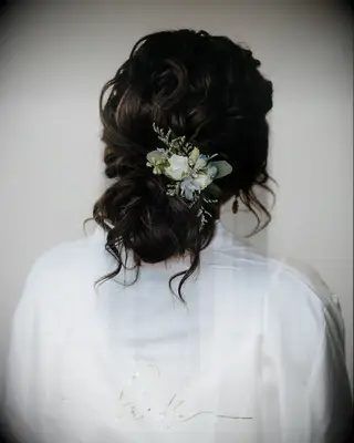 Medium length wedding updo with greenery 