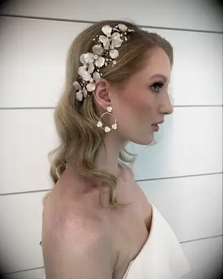 Floral hairpiece medium length wedding hairstyle