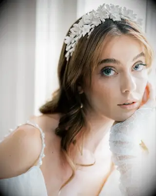 Floral crown with bangs wedding hairstyle 