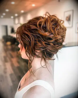 Textured french twist with bangs wedding hairsyle