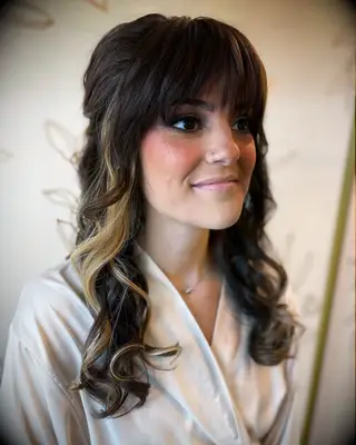Full bang half up wedding hairstyle