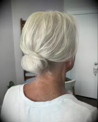 Thin hair low bun wedding hairstyle