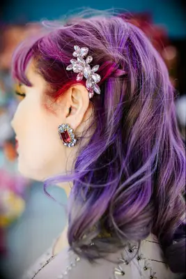 Curly purple hair with hair clip