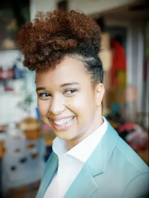 Natural curls with side braids