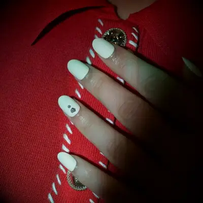 White wedding nails with diamond accents 