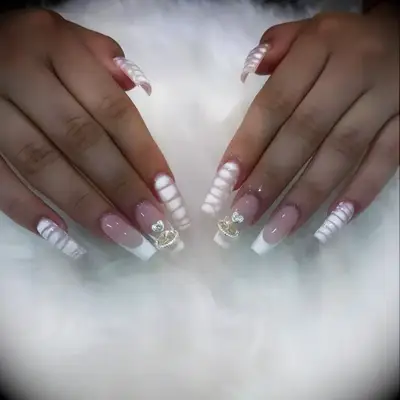 Swirled acrylic nails with jewelry embellishments