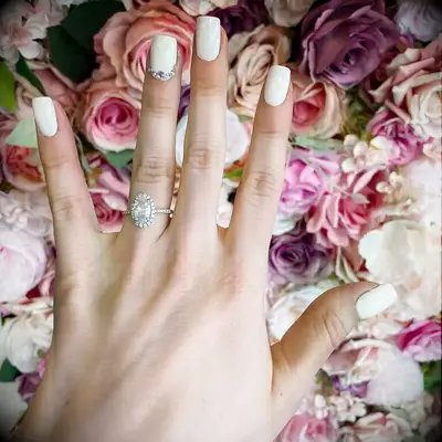 White wedding nails with jewel accent