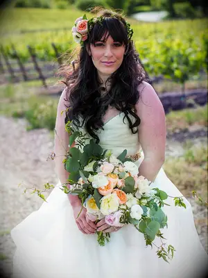 Greenery flower crown with a cluster of garden roses to the side