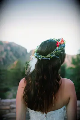 Boho flower crown with a white feather