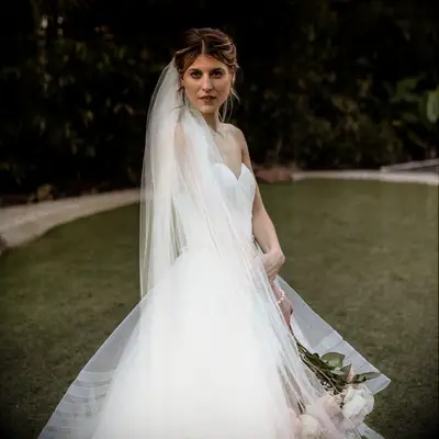 Textured Bun With A Twist strapless dress wedding hairstyle