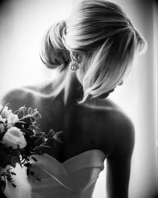 Sophisticated Chignon strapless wedding dress hairstyle