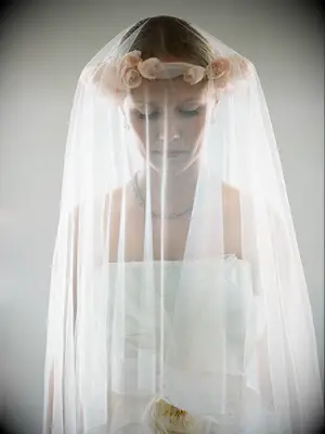 Dramatic wedding veil style with a silk rose flowercrown