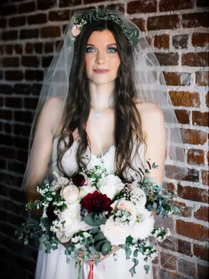 Boho hairstyle and flower crown with a simple veil