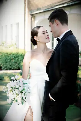 slicked back low bun for your wedding day updo inspo