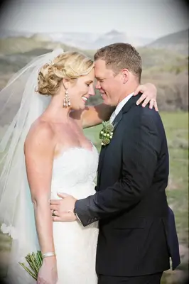 loose curly updo for the best wedding day styles for long hair